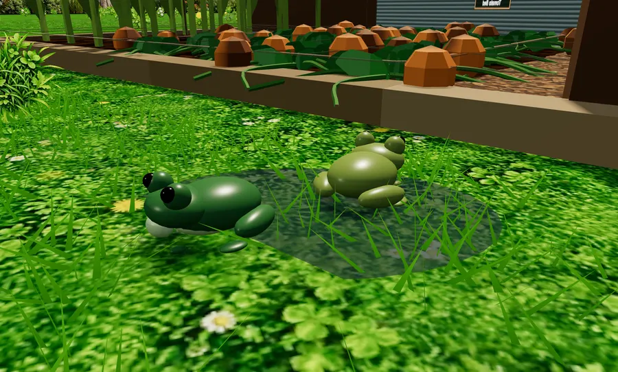 Two frogs sitting by a rain puddle on the lawn