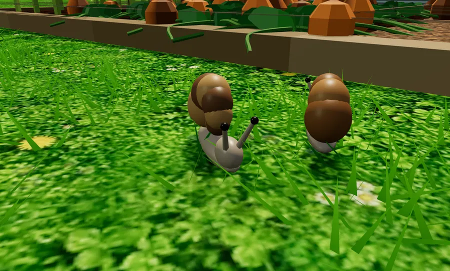 Two snails gliding over the grass